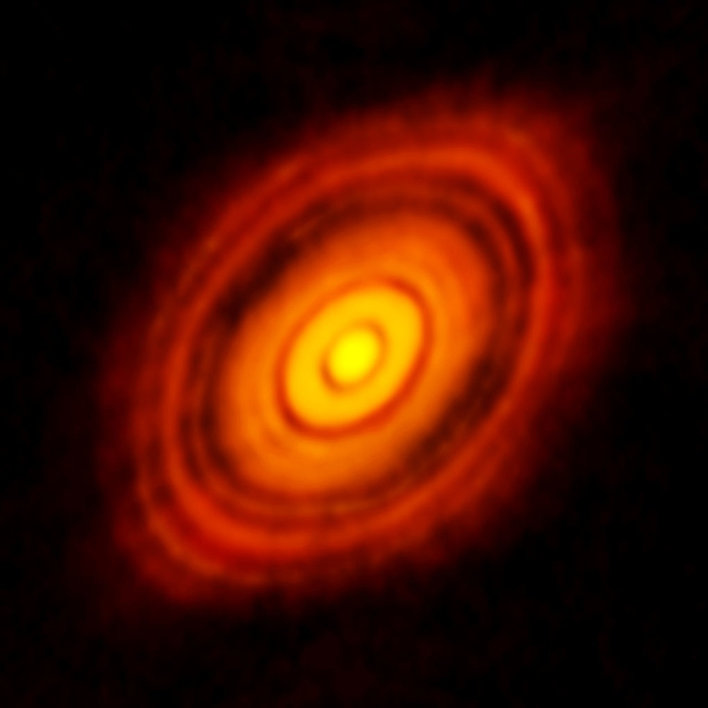 This is the sharpest image ever taken by ALMA — sharper than is routinely achieved in visible light with the NASA/ESA Hubble Space Telescope. It shows the protoplanetary disc surrounding the young star HL Tauri. These new ALMA observations reveal substructures within the disc that have never been seen before and even show the possible positions of planets forming in the dark patches within the system.

Credit:

ALMA (ESO/NAOJ/NRAO)